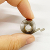 Variable Force Springs for Corrugated Paper Display Racks